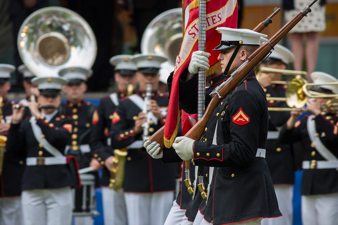 The U.S. Marine Corps Color Guard marches onto the parade deck during the opening ceremony of Marine Week, Detroit, MI., Sept. 6, 2017. Marine Week, hosted by the Marine Corps in one city per year, is a celebration of community, country and Corps that allows the public to connect with Marines through live-demonstrations, hands-on static displays and several other interactive events. (Official U.S. Marine Corps photo by Cpl. Robert Knapp/Released)