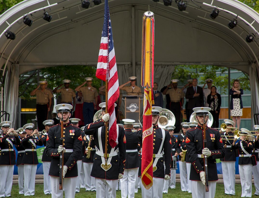 The U.S. Marine Corps Color Guard presents the National Ensign and U.S. Marine Corps Battle Colors during the opening ceremony of Marine Week, Detroit, MI., Sept. 6, 2017. Marine Week, hosted by the Marine Corps in one city per year, is a celebration of community, country and Corps that allows the public to connect with Marines through live-demonstrations, hands-on static displays and several other interactive events. (Official U.S. Marine Corps photo by Cpl. Robert Knapp/Released)