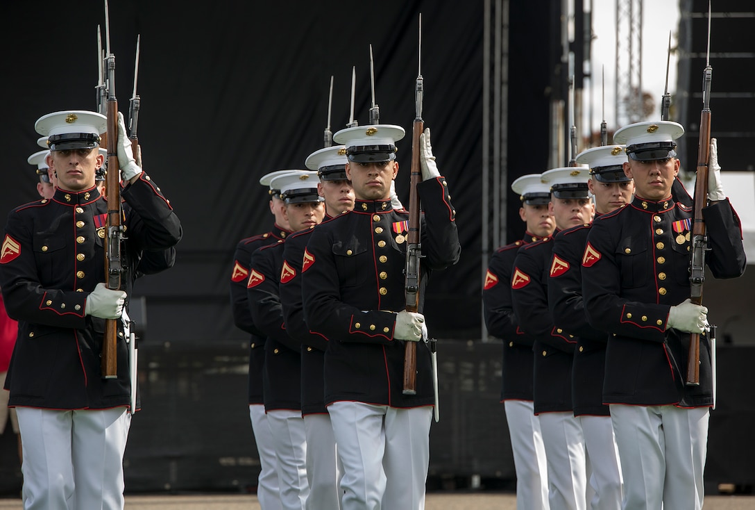 Marines of the U.S. Marine Corps Silent Drill Platoon execute precision rifle and drill maneuvers during a performance at the static display section of Marine Week, Detroit, MI. Sept. 7, 2017. Marine Week, hosted by the Marine Corps in one city per year, is a celebration of community, country and Corps that allows the public to connect with Marines through live-demonstrations, hands-on static displays and several other interactive events. (Official U.S. Marine Corps photo by Cpl. Robert Knapp/Released)