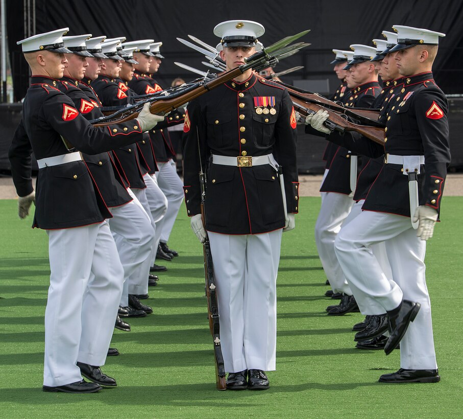 Marines of the U.S. Marine Corps Silent Drill Platoon execute their “meat grinder” sequence during a performance at the static display section of Marine Week, Detroit, MI. Sept. 7, 2017. Marine Week, hosted by the Marine Corps in one city per year, is a celebration of community, country and Corps that allows the public to connect with Marines through live-demonstrations, hands-on static displays and several other interactive events. (Official U.S. Marine Corps photo by Cpl. Robert Knapp/Released)