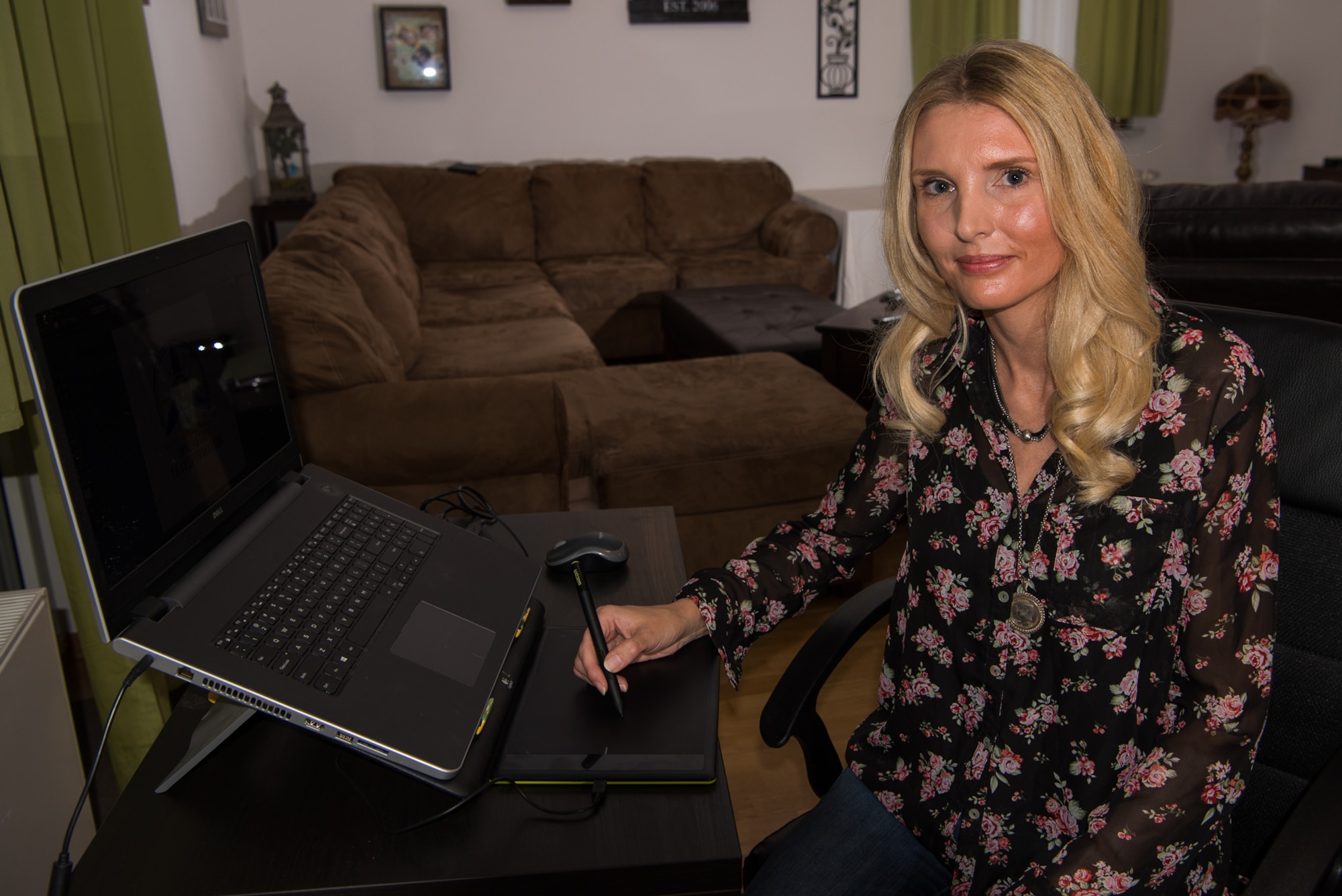 Sabine Allen, graphic designer and spouse of U.S. Army Staff Sgt. Anthony Allen, Religious Service Office noncommissioned officer in charge at Kleber Kaserne, uses her drawing tablet at her home on Vogelweh Military Complex, Germany, Sept. 13, 2017. Allen recently won the 86th Force Support Squadron Continuous Process Improvement office and Innovation Program’s logo contest. (U.S. Air Force photo by Airman 1st Class Devin M. Rumbaugh)