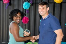 U.S. Air Force Reserve Col. Christopher T. Lay, commander, 913th Airlift Group, and Senior Airman Arnetta Porter, 96th Aerial Port Squadron, pose for a photo during the group’s “Family Day” celebration at Little Rock Air Force Base, Ark., Sept. 10, 2017. Porter was presented with the 2017 Airman of the Period award for the 913 AG. Other winners were Staff Sgt. Dana Greenlee in the Non-commissioned Officer category, Master Sgt. Jason Bison in the Senior Non-commissioned Officer category, 1st Lt. Anthony Ciaacio in the Company Grade Officer category, and Mr. Daniel Zimmer in the Civilian category. (U.S. Air Force photo by Master. Sgt. Jeff Walston/Released)