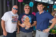 (From right) U.S. Air Force Reserve Col. Christopher T. Lay, commander, 913th Airlift Group, Bob Grissom and Bradley West, pose for a photo during the group’s “Family Day” celebration at Little Rock Air Force Base, Ark., Sept. 10, 2017. Lay presented Grissom and West, who are part of the Gwatney Grilling Team, with a plaque for their support of the 913 AG event. The grilling team was formed after the 2014 Viola, Ark., tornado to support local communities. This year, the team has already served over 15,000 people at no charge. (U.S. Air Force photo by Master. Sgt. Jeff Walston/Released)