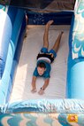 Cody Hamilton attempts to master the art of water sliding during the 913th Airlift Group’s “Family Day” celebration at Little Rock Air Force Base, Ark., Sept. 10, 2017. Brantley is the son of U.S. Air Force Reserve Master Sgt. Benjamin Hamilton, production supervisor, 913th Maintenance Squadron. (U.S. Air Force photo by Master. Sgt. Jeff Walston/Released)