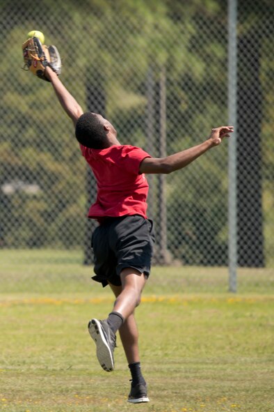 U.S. Air Force Reserve Senior Airman Sylvester Kendricks stretches for the catch during a softball game at the Annual 913th Airlift Group’s “Family Day” celebration at Little Rock Air Force Base, Ark., Sept. 10, 2017. Several 913 AG units fielded softball teams for the friendly competition. (U.S. Air Force photo by Master. Sgt. Jeff Walston/Released)