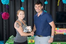 U.S. Air Force Reserve Col. Christopher T. Lay, commander, 913th Airlift Group, and Tech Sgt. Dana Greenlee, 913th Maintenance Squadron, pose for a photo during the group’s “Family Day” celebration at Little Rock Air Force Base, Ark., Sept. 10, 2017. Greenlee was presented with the 2017 Non-commissioned Officer of the Period award for the 913 AG. Other winners were Senior Airman Arnetta Porter in the Airman category, Master Sgt. Jason Bison in the Senior Non-commissioned Officer category, 1st Lt. Anthony Ciaacio in the Company Grade Officer category, and Mr. Daniel Zimmer in the Civilian category. (U.S. Air Force photo by Master. Sgt. Jeff Walston/Released)