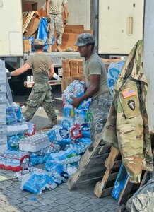 Soldiers of 3rd Battalion, 133rd Field Artillery Regiment based in El Paso, Texas with first responders, the Cajun Navy and civilian volunteers tirelessly work points of distribution as relief teams to provide Texans affected by Hurricane Harvey more than 18,000 cases of water daily and nearly 320,000 pounds of ice, and tens of thousands of pounds of donated necessities, such as toilet paper, baby food and diapers, tarps, hygiene items, clothing and cleaning supplies, Sept. 3 2017.