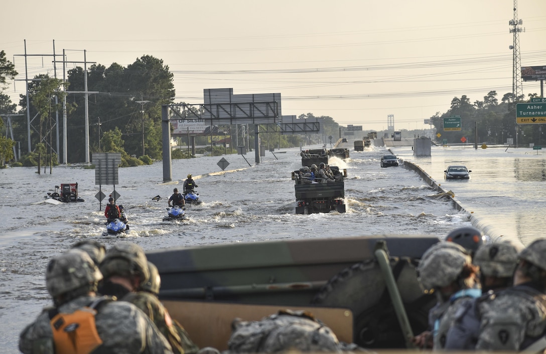 Soldiers from 3rd Battalion, 133rd Field Artillery Regiment based out of El Paso, Texas, ford through floodwaters to get to Texans in need after Hurricane Harvey on Sept. 1, 2017. The battalion convoyed West to East the entire 860-mile Texas stretch of Interstate Highway 10 to conduct rescue and relief operations in Orange County, Texas.