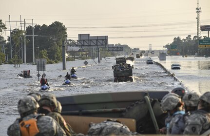 Soldiers from 3rd Battalion, 133rd Field Artillery Regiment based out of El Paso, Texas, ford through floodwaters to get to Texans in need after Hurricane Harvey on Sept. 1, 2017. The battalion convoyed West to East the entire 860-mile Texas stretch of Interstate Highway 10 to conduct rescue and relief operations in Orange County, Texas.