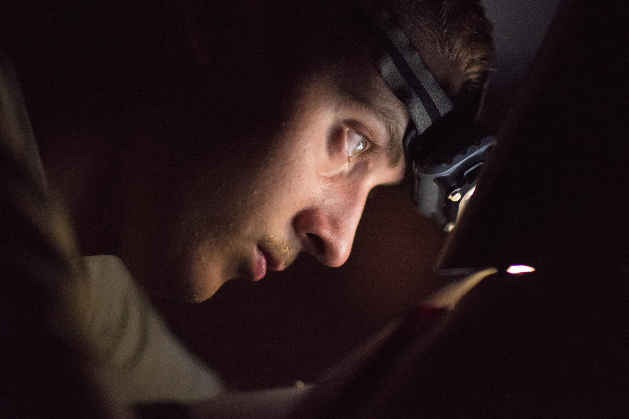 Airman 1st Class Harrison Goff, 332nd Expeditionary Maintenance Squadron weapons load crew member, wires a computer control group for a laser-guided bomb August 12, 2017, in Southwest Asia. The weapons flight works around the clock to ensure bombs and missiles are loaded onto F-15E Strike Eagles and that the weapons systems function properly. (U.S. Air Force photo/Senior Airman Damon Kasberg)