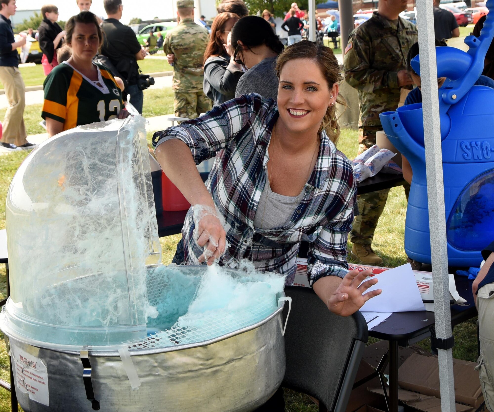 Master Sgt. Kelli Swanton, 178th Civil Engineer Production Controller, prepares cotton candy at the Springfield Air National Guard Base, Springfield Ohio during the Wing's Family Day event Sept. 10, 2017.