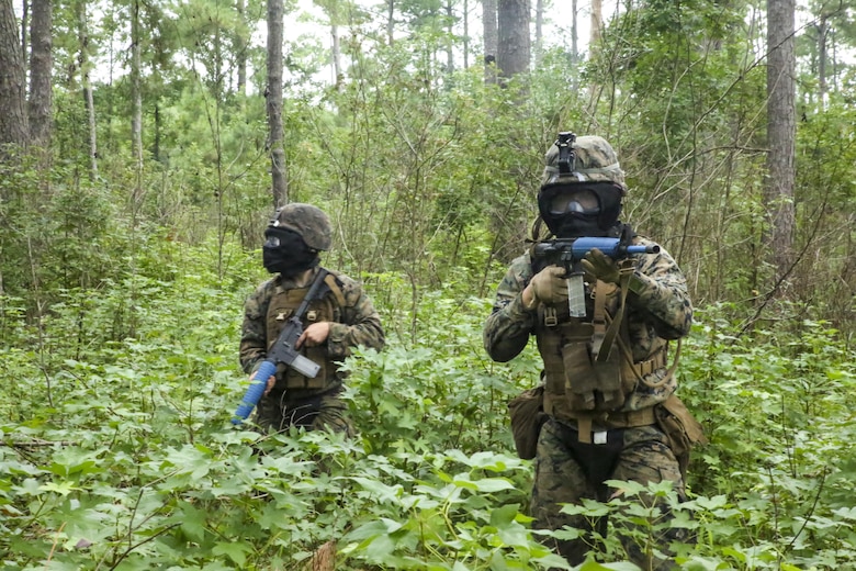 Marines clear the area after conducting an ambush on opposing forces during defensive operations training at Camp Lejeune, N.C., Aug. 31, 2017. The exercise is used by the battalion to improve proficiency with combat tactics and in preparation for future operations. The Marines are with Echo Company, 2nd Battalion, 8th Marine Regiment. (U.S. Marine Corps photo by Lance Cpl. Holly Pernell)