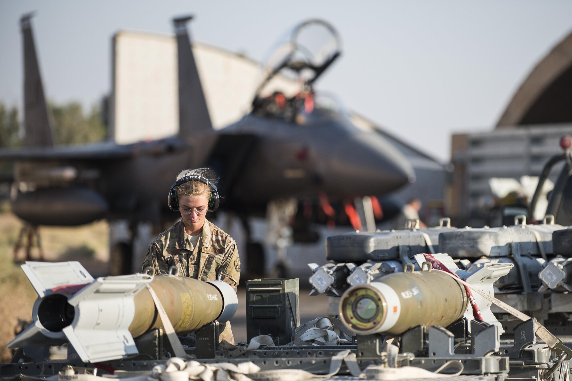 Senior Airman Amanda Butch, 332nd Expeditionary Maintenance Squadron line delivery technician, accounts for munition that was loaded on a trailer August 13, 2017, in Southwest Asia. The 332nd EMXS is charged with safely loading and offloading munitions on to F-15E Strike Eagles in support of Operation Inherent Resolve. (U.S. Air Force photo/Senior Airman Damon Kasberg)