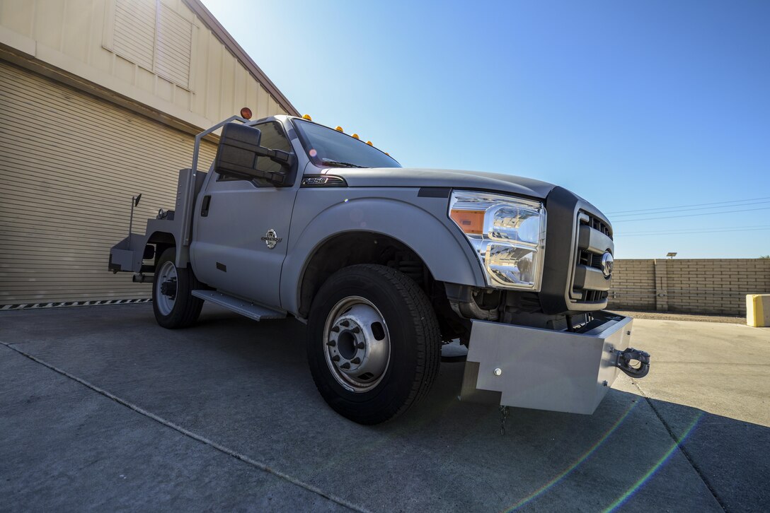 A bobtail is parked outside of a Logistics Readiness Squadron facility Sept. 14, 2017 at Luke Air Force Base, Ariz. The bobtails, which are a specialized towing vehicle used to haul various types of equipment on the flightline, were found to have a hardware issue with the pintle hook assembly creating a FOD concern. A team of approximately nine Airmen developed an innovative solution to fix the issue now being implemented into the F-35 program. (U.S. Air Force photo/Airman 1st Class Caleb Worpel)