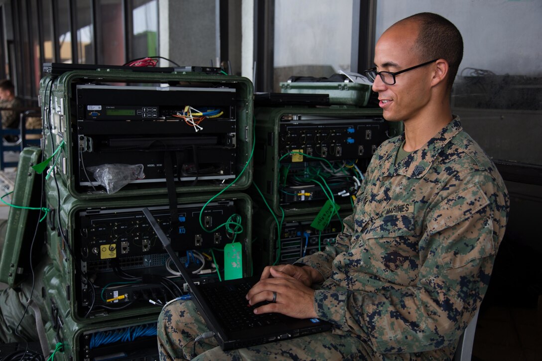 U.S. Marine Corps Sgt. Jose Pena, data specialist with the 26th Marine Expeditionary Unit (MEU), monitors communications at Cyril E. King Airport, St. Thomas, U.S. Virgin Islands, Sept. 14, 2017. The Department of Defense is assisting Federal Emergency Management Agency in hurricane relief efforts by providing food, water and essential care items to the U.S. Virgin Islands. (U.S. Marine Corps photo by Lance Cpl. Alexis C. Schneider)