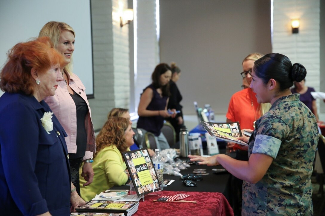 Marines with Marine Aircraft Group (MAG) 39 speak to vendors during the Hunger for Strength symposium hosted by the MAG-39 Women’s Leadership and Education Committee at Marine Corps Base Camp Pendleton, Calif., Aug. 30. The symposium is designed with the idea of providing Marines and Sailors an opportunity to gain tools which will enable them to thrive and grow in their work environment including networking with like-minded people, finding mentors, and understanding their value and sense of purpose, ultimately strengthening the force. (U.S. Marine Corps photo by Sgt. Brytani Wheeler)