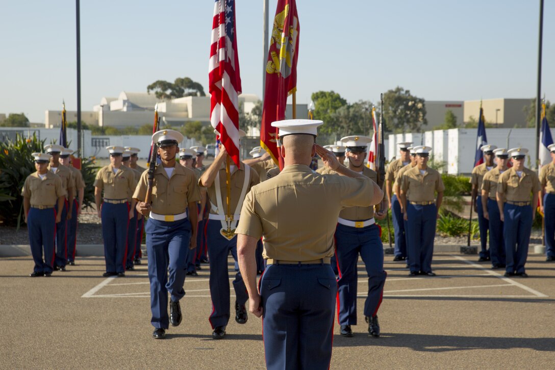 Col. Jeff Vandaveer, commanding officer of Marine Air Control Group (MACG) 38, salutes the American flag during a battle colors rededication ceremony at Marine Corps Air Station Miramar, Calif., Sept. 1. During the ceremony, Vandaveer recognized the group’s 50th anniversary and rededicated its battle colors, commending past achievements and looking forward to future accomplishments. “While the rededication of the unit’s battle streamers centers on 38’s past achievements, this ceremony is all about the Marines – all of the Marines that were a part, that are a part and will be a part of this control group,” said Vandaveer. “I’m humbled by the opportunity to participate in this ceremony … I’m extremely excited about the Marines I serve along with today and even look forward to seeing what we, Marines of control group 38, do in the future.” (U.S. Marine Corps photo by Sgt. Lillian Stephens/Released)