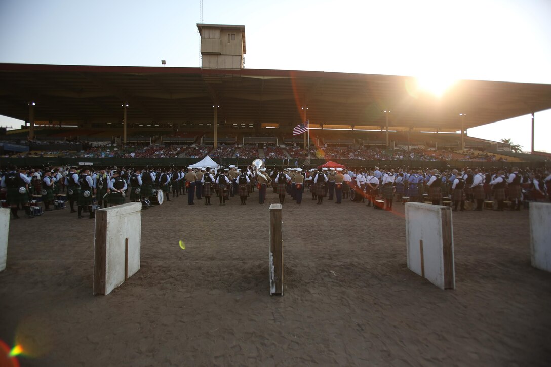 Marines with the 3rd Marine Aircraft Wing (MAW) band stand in a mass formation of pipe bands from around the world during the 152nd Scottish Highland Gathering and Games closing ceremony in Pleasanton, Calif., Sept. 2. In addition to performing concerts, 3rd MAW band members built relationships with pipe bands from around the world including Scotland, Canada and the United States. (U.S. Marines Corps photo by Sgt. David Bickel/Released)