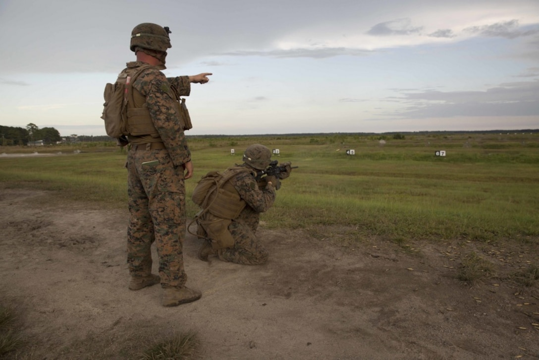 A range safety officer directs a Marine on the firing line during a combat marksmanship program at Camp Lejeune, N.C., Aug 31, 2017. The Marines took part in the routine qualification training to maintain their combat skills for mission readiness. The Marines are with 2nd Light Armored Reconnaissance Battalion. (U.S. Marine Corps photo by Pfc. Nicholas Guevara)