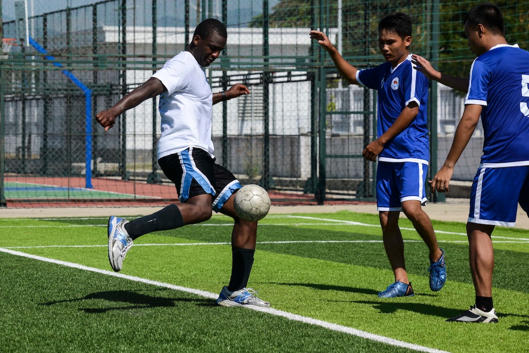 CAM RAHN INTERNATIONAL PORT, Vietnam — Marines and Sailors with the 15th Marine Expeditionary Unit and the America Amphibious Ready Group enjoy a game of soccer with guards of Cam Rahn International Port, Aug. 10, 2017. The soccer game was a way for both countries to build comradery while having fun playing a sport all players are passionate about. The 15th MEU and America ARG are operating in the U.S. 7th Fleet area of operations to enhance regional partnerships and serve as a ready-response capability for any type of contingency. (U.S. Marine Corps photo by Cpl. Timothy Valero)