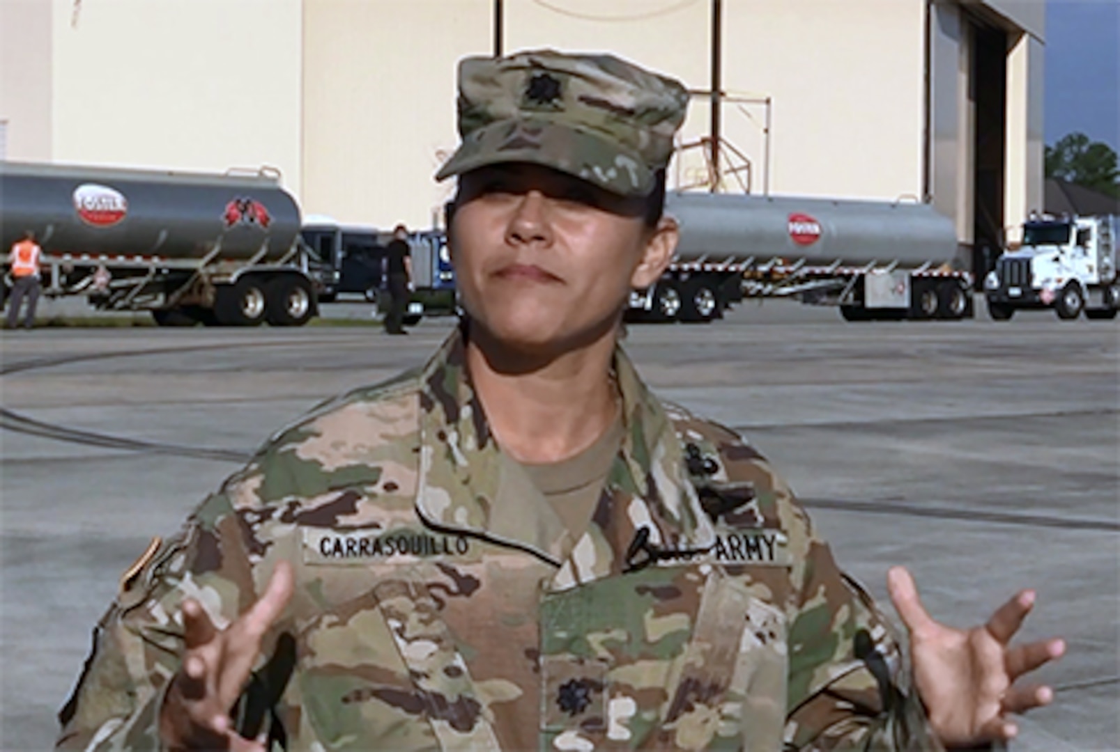 DLA Energy Americas at Houston Commander Army Lt. Col. Josiel Carrasquillo stands in front of Foster Fuels trucks at Warner Robins Air Force Base