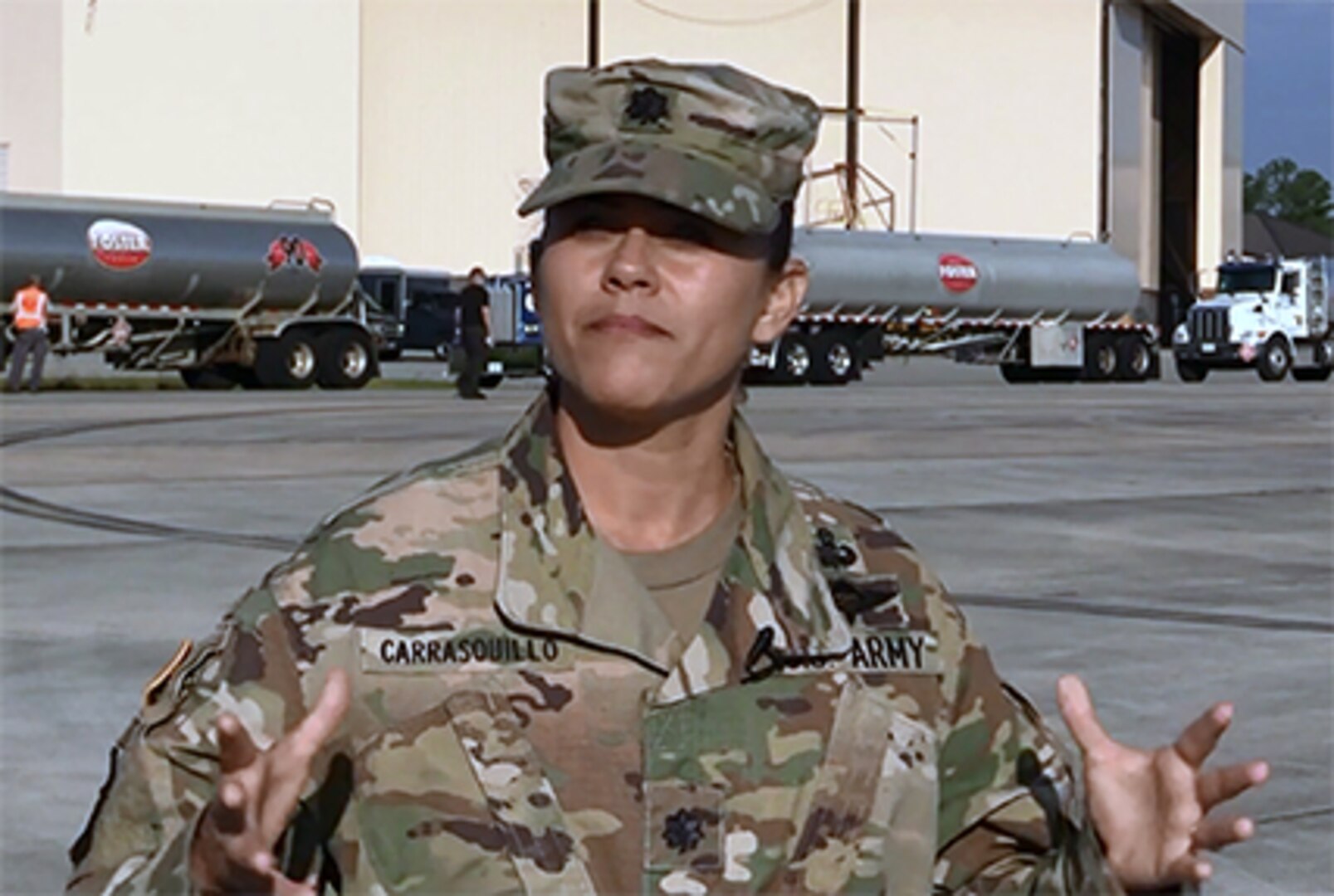 DLA Energy Americas at Houston Commander Army Lt. Col. Josiel Carrasquillo stands in front of Foster Fuels trucks at Warner Robins Air Force Base