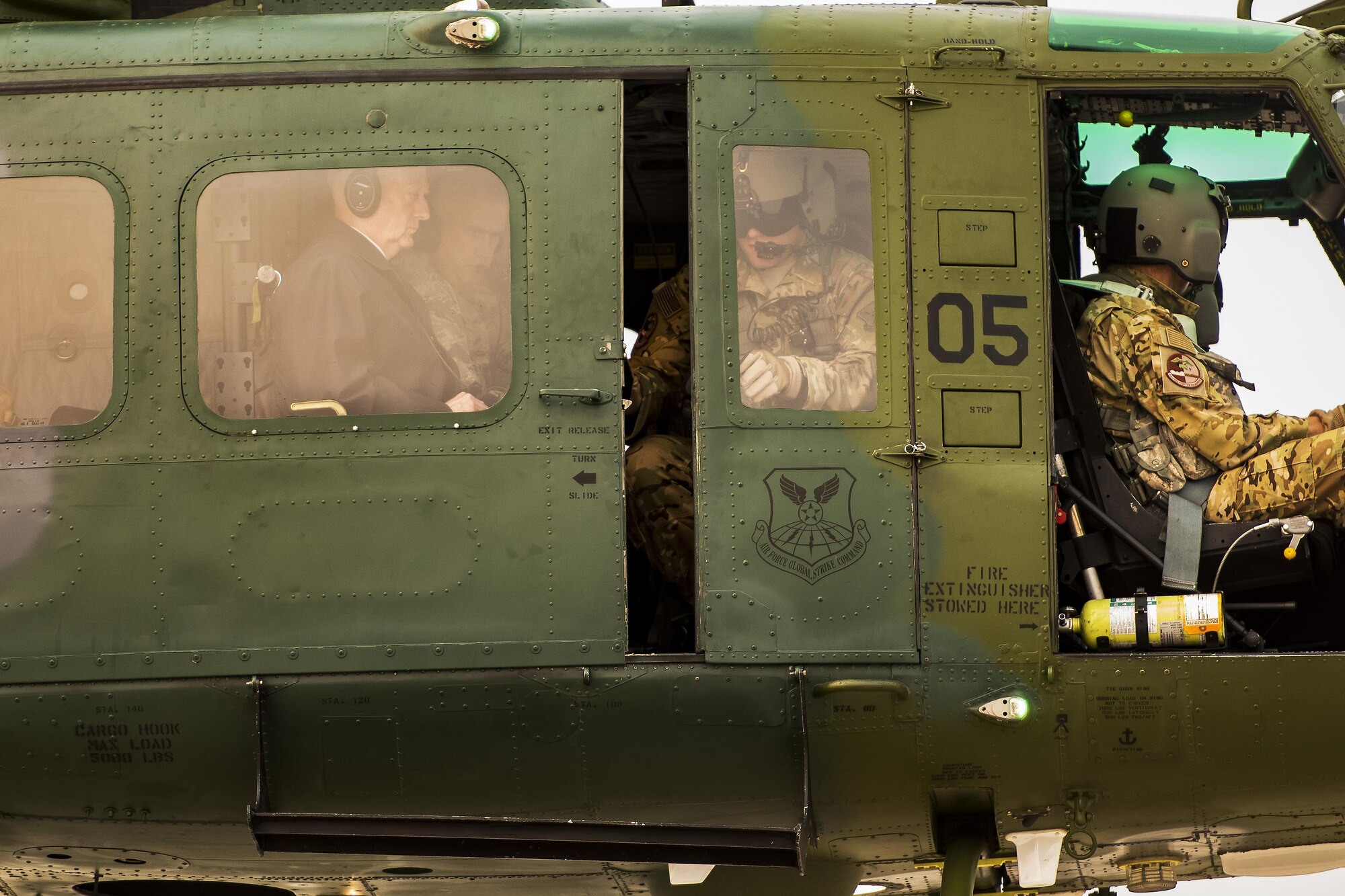 Secretary of the Defense Jim Mattis flies aboard a UH-N1 Iroquois above Minot Air Force Base, N.D., Sept. 13, 2017. During his visit, Mattis flew to J-01 Missile Alert Facility to speak with 91st Missile Wing members about the importance of the nuclear deterrence mission. (U.S. Air Force photo/Senior Airman J.T. Armstrong)