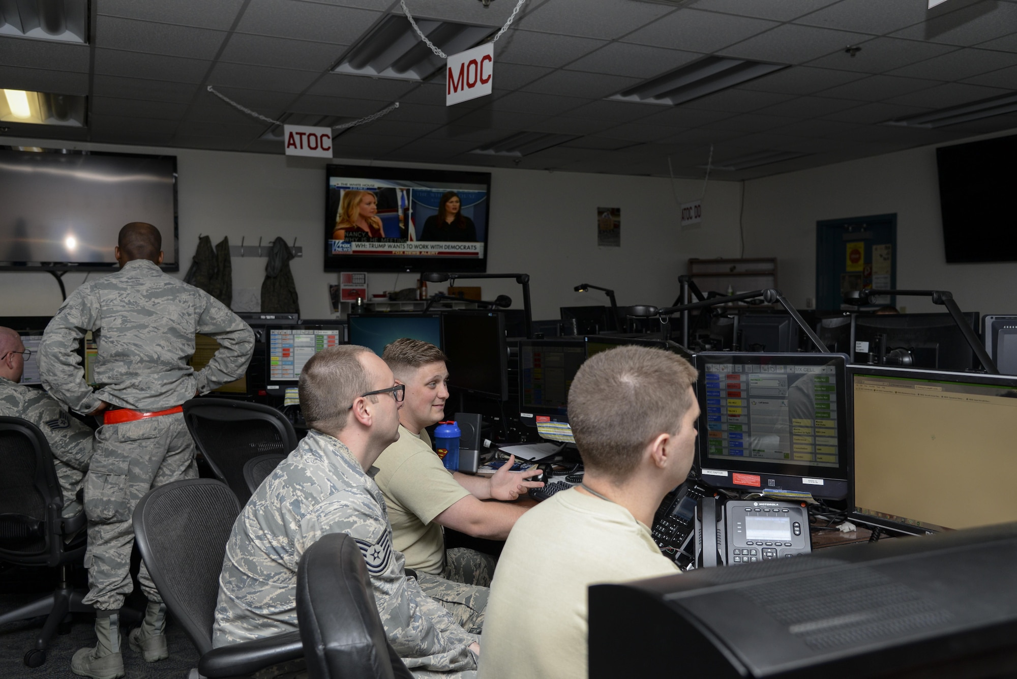 Maintenance Operations Center Airmen update maintenance logs Sept. 13, 2017, in the Command Post on Dover Air Force Base, Del. The MOC is one of three agencies that operate out of the Command Post, including Command and Control Operations and the Air Terminal Operations Center. (U.S. Air Force photo by Staff Sgt. Aaron J. Jenne)