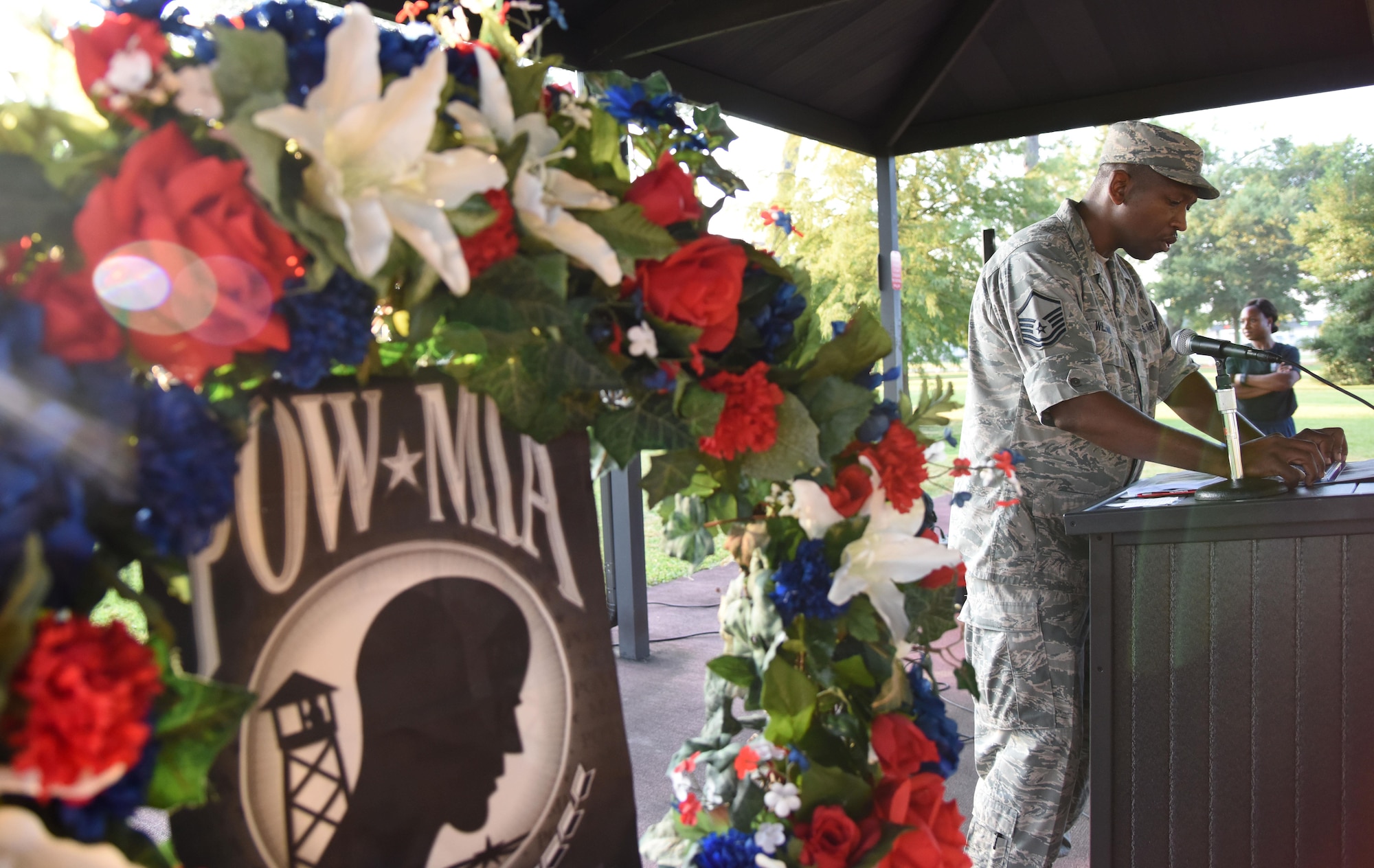 Master Sgt. Clarence Williams, 81st Surgical Operations Squadron operating room flight chief, reads the names of those who were prisoners of war or are missing in action during Keesler’s POW/MIA 24-hour memorial run and vigil at the Crotwell Track Sept. 14, 2017, on Keesler Air Force Base, Mississippi. The event was held to raise awareness and pay tribute to all prisoners of war and those military members still missing in action. (U.S. Air Force photo by Kemberly Groue)