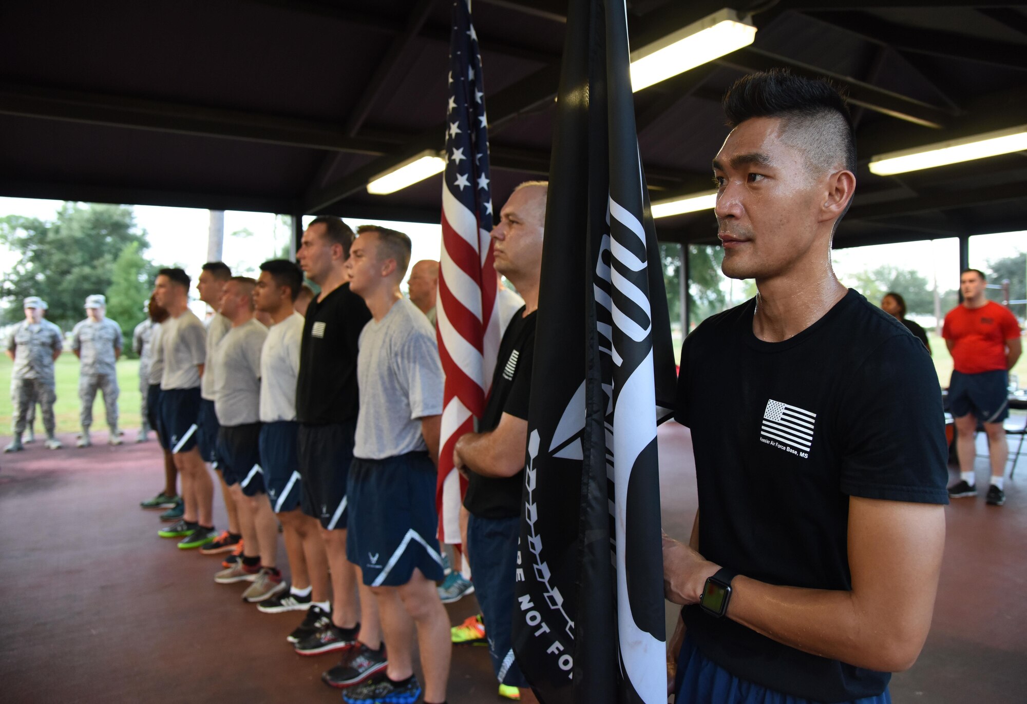 Staff Sgt. Mikhel Carpio, 81st Communications Squadron client systems technician, stands in formation during Keesler’s POW/MIA 24-hour memorial run and vigil at the Crotwell Track Sept. 14, 2017, on Keesler Air Force Base, Mississippi. The event was held to raise awareness and pay tribute to all prisoners of war and those military members still missing in action. (U.S. Air Force photo by Kemberly Groue)