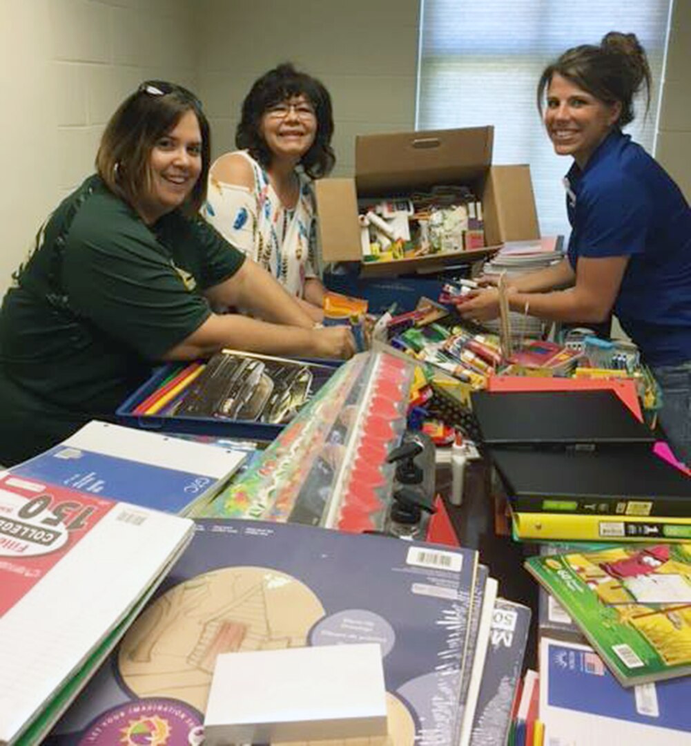 Lori Fuller, Robert G. Cole's instructional design coach; and Dr. Isabell Clayton, Robert G. Cole Middle and High School principal, deliver supplies and $400 in gift cards to Dr. Jill Blankenship, principal of Blaschke Sheldon Elementary in the Ingleside Independent School District.