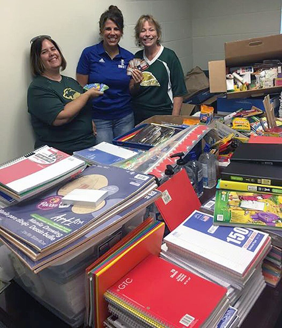 School Supplies 2: Dr. Jill Blankenship, principal of Blaschke Sheldon Elementary in the Ingleside Independent School District; Sylvia Elizondo, the superintendent's administrative assistant; and Lori Fuller, Robert G. Cole's instructional design coach, sort supplies.