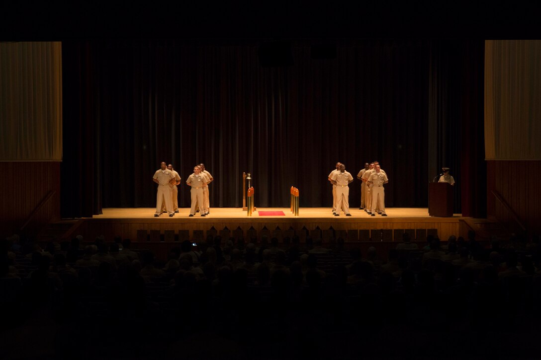 Sailors with 2nd Marine Logistics Group prepare to be promoted to Chief Petty Officer during a chief pinning ceremony at Camp Lejeune, N.C., Sept. 15, 2017. Navy Chief Petty Officers are both technical experts who train newly-commissioned junior officers and leaders whose commands are strictly followed by their subordinates. (U.S. Marine Corps photo by Lance Cpl. Abrey D. Liggins.)