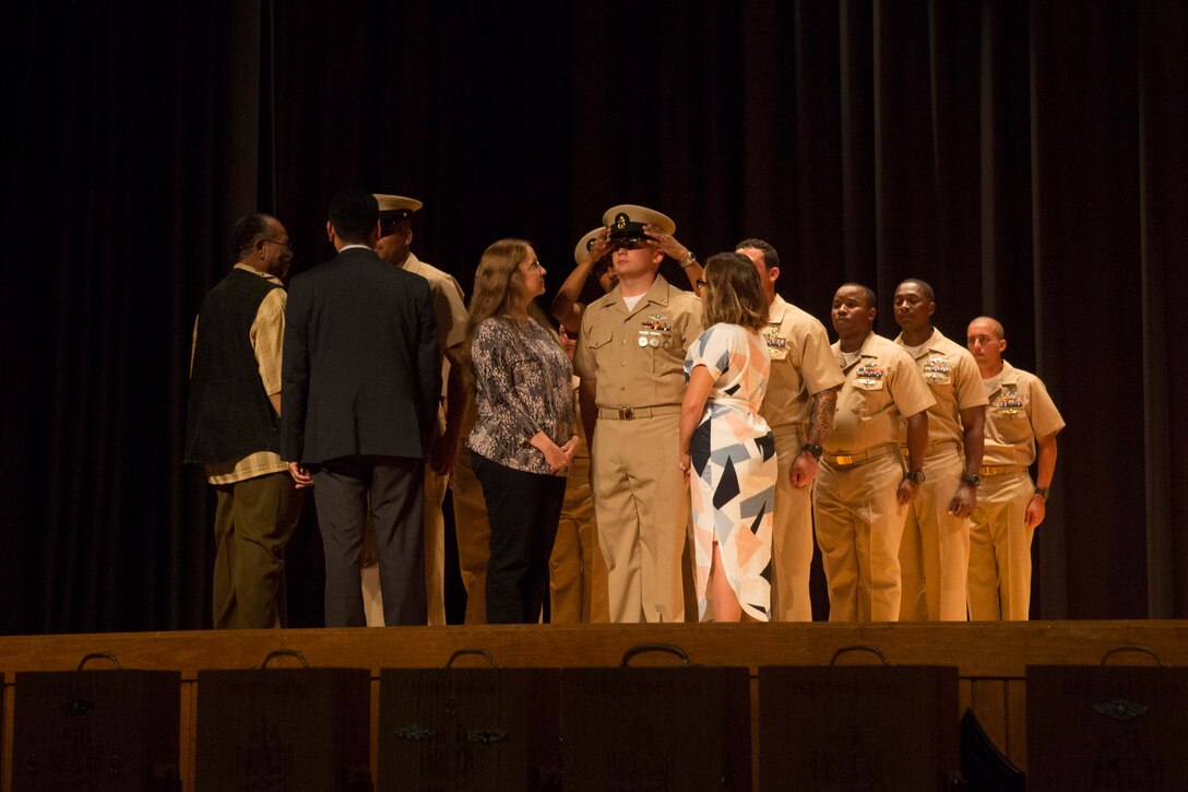 Sailors with 2nd Marine Logistics Group are promoted to Chief Petty Officer during a chief pinning ceremony at Camp Lejeune, N.C., Sept. 15, 2017. Navy Chief Petty Officers are both technical experts who train newly-commissioned junior officers and leaders whose commands are strictly followed by their subordinates.  (U.S. Marine Corps photo by Lance Cpl. Abrey D. Liggins.)