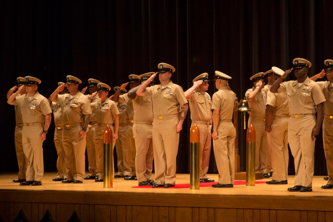 A Sailor with 2nd Marine Logistics Group is presented as a Chief Petty Officer during a chief pinning ceremony at Camp Lejeune, N.C., Sept. 15, 2017. Navy Chief Petty Officers are both technical experts who train newly-commissioned junior officers and leaders whose commands are strictly followed by their subordinates. (U.S. Marine Corps photo by Lance Cpl. Abrey D. Liggins.)