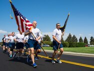 Members of the 60th Air Mobility Wing finish up a 24-hour vigil run to commemorate POWs and MIAs at Travis Air Force Base, Calif., on Sept. 15, 2017. The run was followed up by a remembrance ceremony.