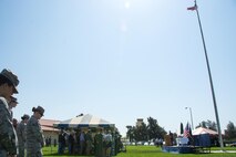 Members of Team Travis pause for a moment to remember POWs and MIAs during a commemoration ceremony at Travis Air Force Base, Calif., on Sept. 15, 2017. Until July 18, 1979, no commemoration was held to honor America’s POW/MIAs.