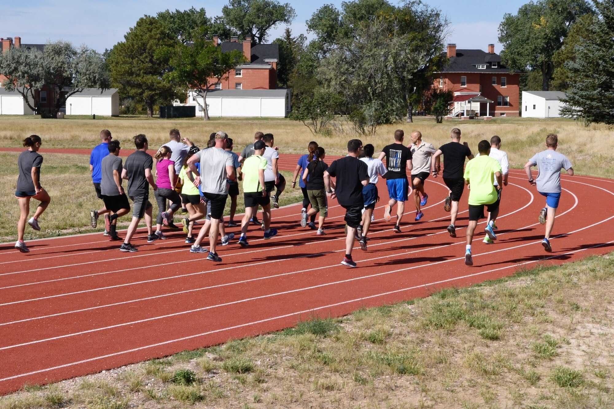 Biomechanical Specialist Ian Adamson and natural running clinic participants practice various drills and running forms to increase the longevity of one’s physical health at F.E. Warren Air Force Base, Wyo., Sept. 13, 2017.