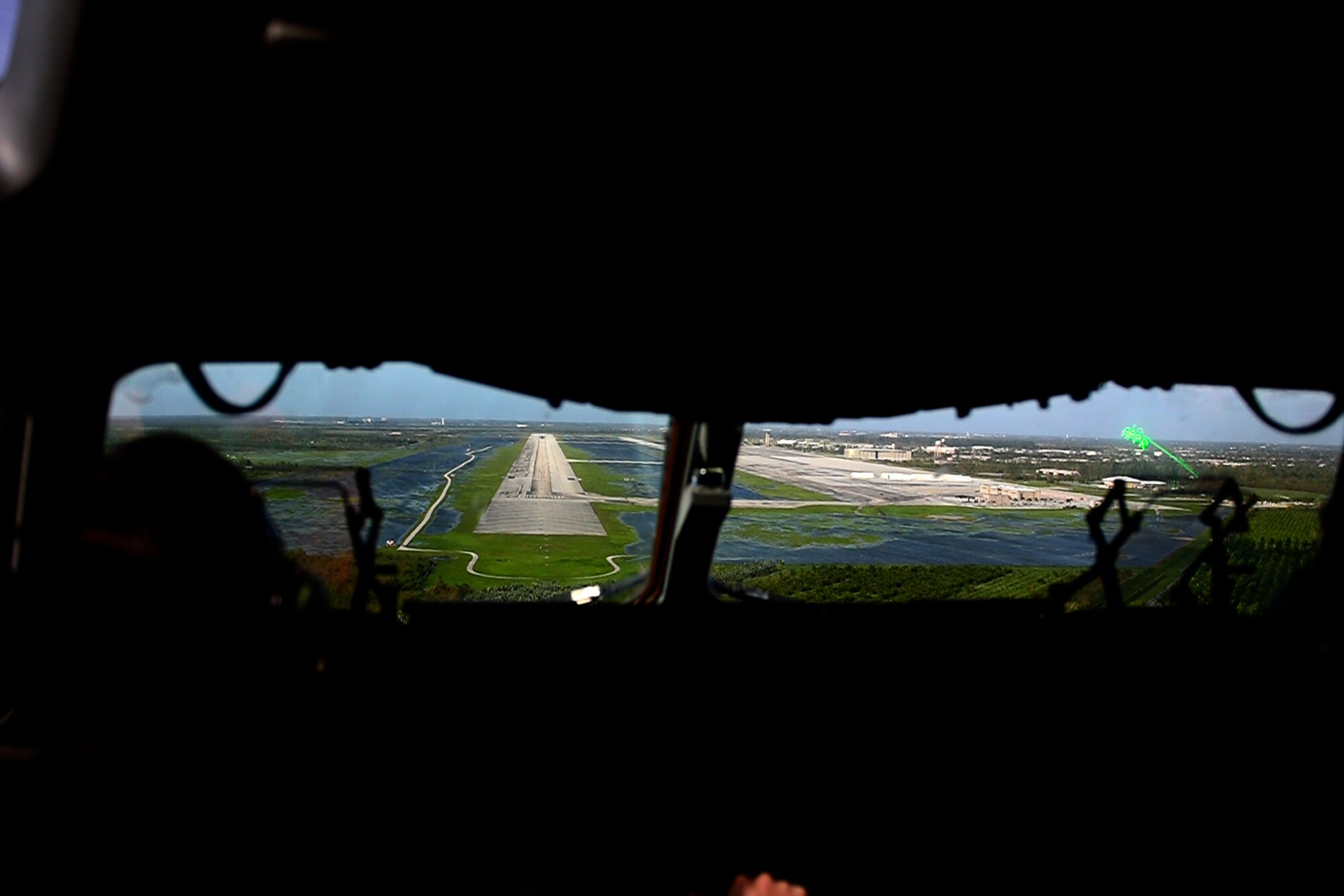 U.S. Air Force Capt. Daniel Cascio, and 1st Lt Ty Wojtysiak, 16th Airlift Squadron pilots, prepare to land on a flightline effected by hurricane waters while conducting a relief aid mission in response to Hurricane Irma on Homestead Air Reserve Base, Fla. Sept. 11, 2017. C-17 Globemaster II's from Joint Base Charleston relocated to Scott AFB, Ill. to carry pallets of aid, equipment, and more than 100 personnel to responded to the areas effected by Hurricane Irma. (U.S. Air Force photo by Staff Sgt. Paul Labbe)