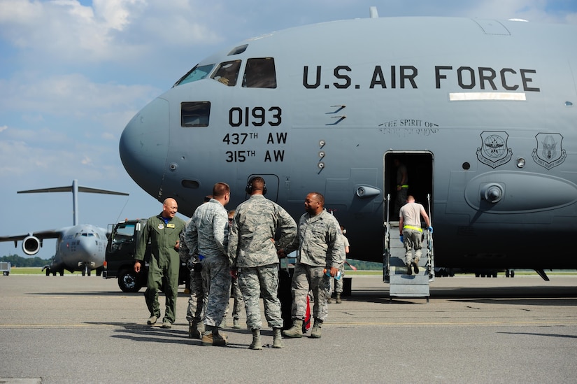 Col. Jimmy Canlas, 437th Airlift Wing commander, welcomes Airmen returning with the final C-17 Globemaster III that was evacuated here due to Hurricane Irma’s potential landfall Sept. 15, 2017. Twenty-two C-17s were evacuated to alternate locations and eight were diverted in response to the hurricane. Airmen from the 437th Aircraft Maintenance Squadron ensured the relocated aircraft were maintained and prepared to conduct hurricane recovery operations from alternate installations including Scott Air Force Base, Ill.