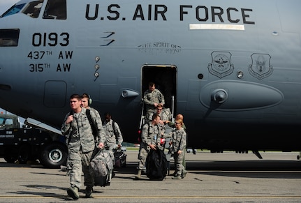 Airmen return to Joint Base Charleston Sept. 15, 2017 with the final C-17 Globemaster III that was evacuated due to Hurricane Irma’s potential landfall. Twenty-two C-17s were evacuated to alternate locations and eight were diverted in response to the hurricane. Airmen from the 437th Aircraft Maintenance Squadron ensured the relocated aircraft were maintained and prepared to conduct hurricane recovery operations from alternate installations including Scott Air Force Base, Ill.