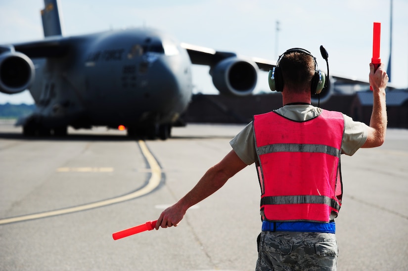 Senior Airman Daniel Guilian, 437th Aircraft Maintenance Squadron crew chief, taxis in the final C-17 Globemaster III evacuated from Joint Base Charleston, S.C. due to Hurricane Irma’s potential landfall here Sept. 15, 2017. More than 20 C-17s were evacuated from JB Charleston by Sept. 9, 2017. Airmen of the 437th Aircraft Maintenance Squadron ensured the relocated C-17s were maintained and prepared to conduct hurricane recovery operations to the South from alternate installations including Scott Air Force Base, Ill. (U.S. Air Force photo by Airman 1st Class Allison Payne)