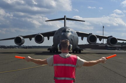 Senior Airman Daniel Guilian, 437th Aircraft Maintenance Squadron crew chief, taxis in the final C-17 Globemaster III evacuated from Joint Base Charleston, S.C. Sept. 15, 2017 due to Hurricane Irma’s potential landfall here. More than 20 C-17s were evacuated from JB Charleston by Sept. 9, 2017. Airmen of the 437th Aircraft Maintenance Squadron ensured the relocated C-17s were maintained and prepared to conduct hurricane recovery operations to the South from alternate installations including Scott Air Force Base, Ill.