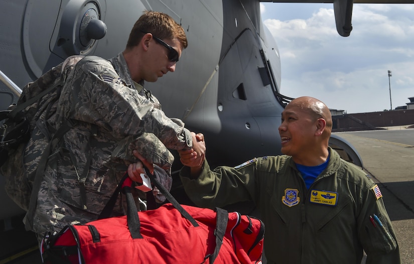 Col. Jimmy Canlas, 437th Airlift Wing commander, welcomes home Airmen of the 437th AW returning with the final evacuated C-17 Globemaster III Sept. 15, 2017 due to Hurricane Irma’s potential landfall here. Twenty-two C-17s were evacuated to alternate locations and eight were diverted in response to the hurricane. Airmen of the 437th Aircraft Maintenance Squadron ensured the relocated aircraft were maintained and prepared to conduct hurricane recovery operations to the south from alternate installations including Scott Air Force Base, Ill.