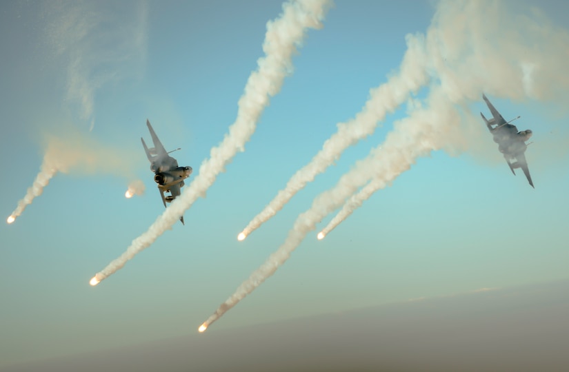 Two F-15E Strike Eagles fire flares over Iraq during a mission in support of Operation Inherent Resolve Sept. 6, 2017. The Strike Eagle is a dual-role fighter designed to perform air-to-air and air-to-ground missions. An array of avionics and electronics systems give the F-15E the capability to fight at low altitude, day or night, and in all weather conditions. (U.S. Air Force photo by Staff Sgt. Trevor T. McBride)