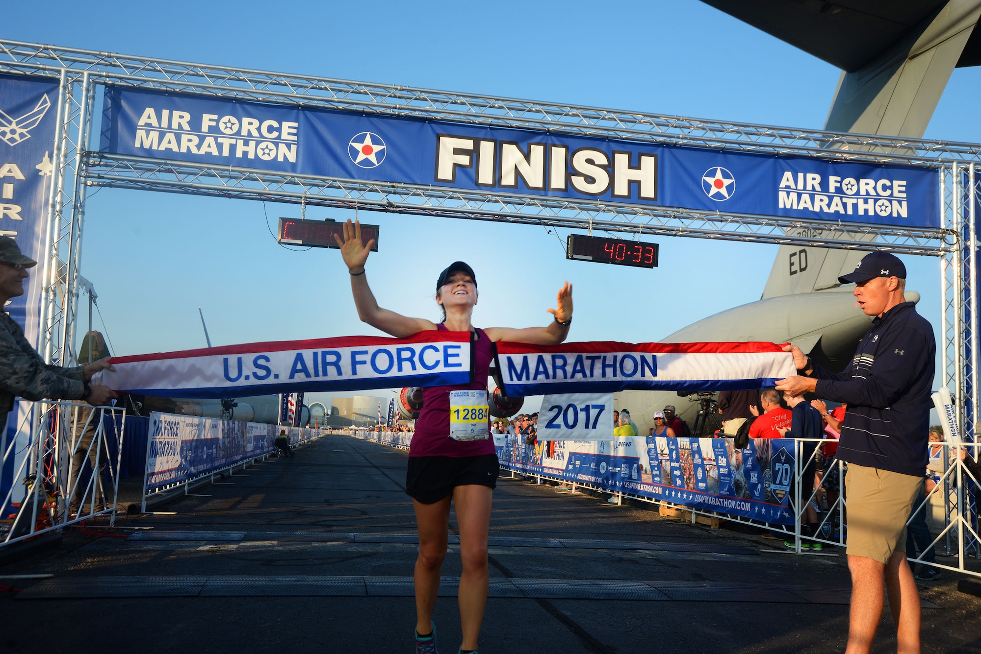 Molly Brown crosses the finish line as the overall women's winner of the 10K race at the 21st running of the 2017 U.S. Air Force Marathon at Wright-Patterson Air Force Base on Sept. 16.  Brown, from Grove City, Ohio, finished with a time of 33:04.  (U.S. Air Force photo / R.J. Oriez)