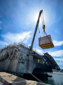Civil service mariners assigned to Military Sealift Command load pallets onto USNS Spearhead (T-EPF 1) at Naval Station Guantanamo Bay.