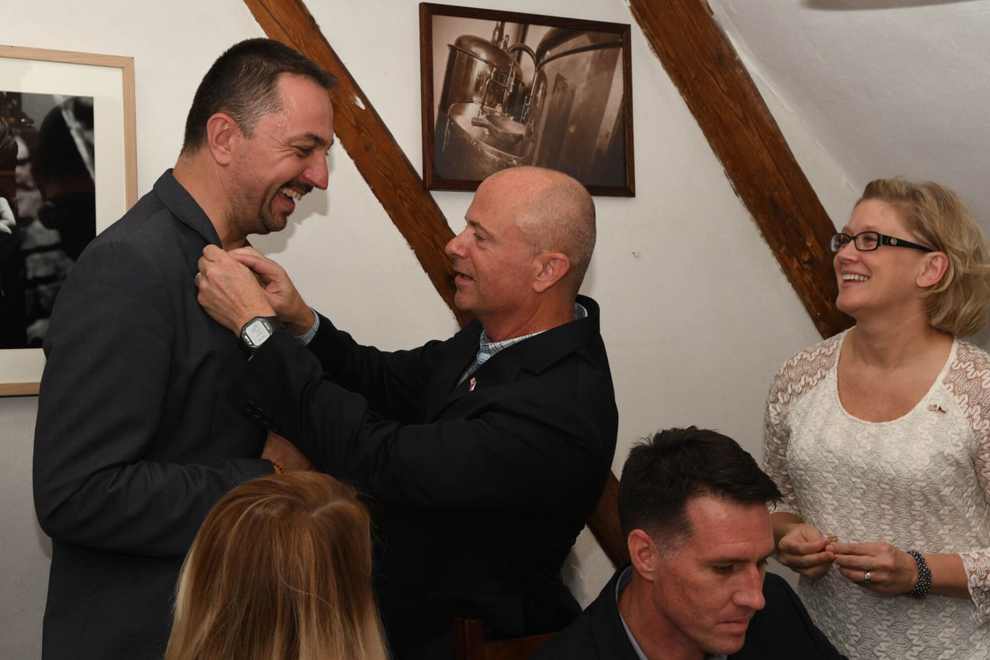 Brig. Gen. Jonathan Ellis, the mobilization assistant to the 8th Air Force Commander, presents a pin to Zbynek Pavlacik, the Jagello 2000 chariman and organizer for the NATO Days Air Show, during the Jagello 2000 Welcome Dinner at the Zábřeh Castle September 14, 2017 in Ostrava, Czech Republic.