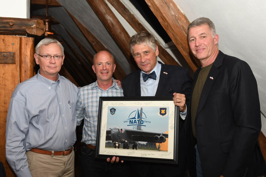 Ivo Vondrak (center right), governor of the Moravian-Silesian Region of the Czech Republic, is presented a photo of a B-52 Stratofortress by Brig. Gen. Jonathan Ellis (center left), the mobilization assistant to the 8th Air Force Commander, Col. Robert VanHoy (left), the 307th Bomb Wing commander, and retired Col. Joe Jones (right), a sister city representative from Shreveport, La., during the Jagello 2000 Welcome Dinner at the Zábřeh Castle September 14, 2017 in Ostrava, Czech Republic.