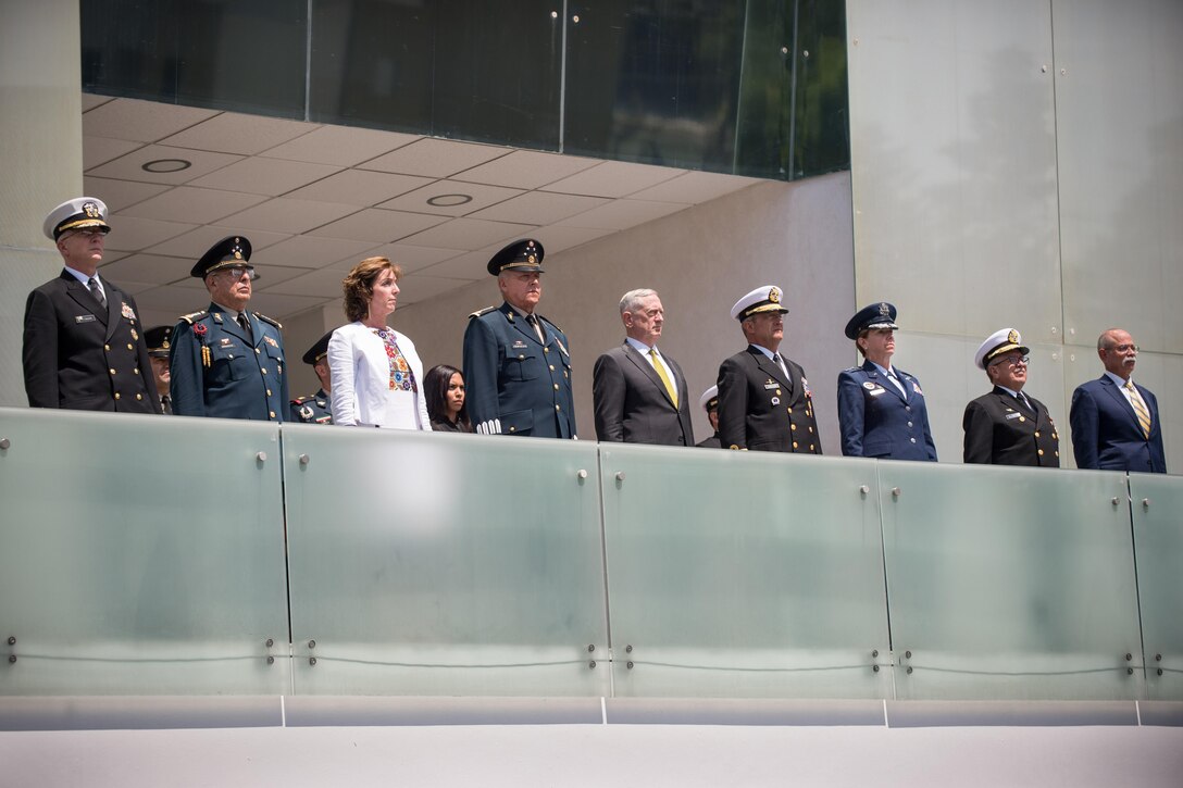 U.S. and Mexican defense leaders stand on a balcony.